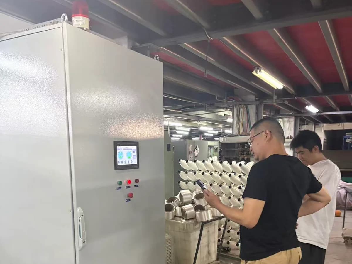 Wilson Technology WS-300 with commissioning personnel in a textile twisting workshop in Hangzhou, Zhejiang.