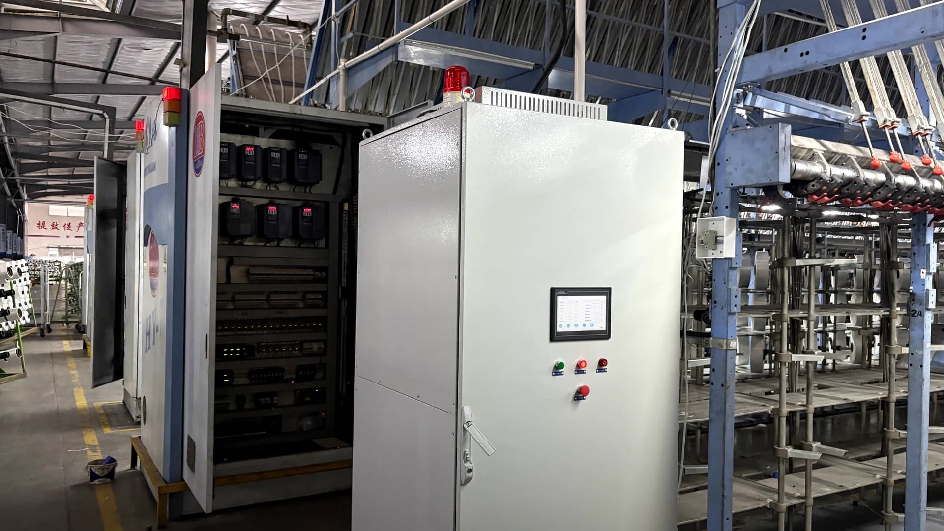 Wilson Technology WS300-66 power continuity cabinet installed beside textile production equipment in a chemical fiber plant in Fujian, China